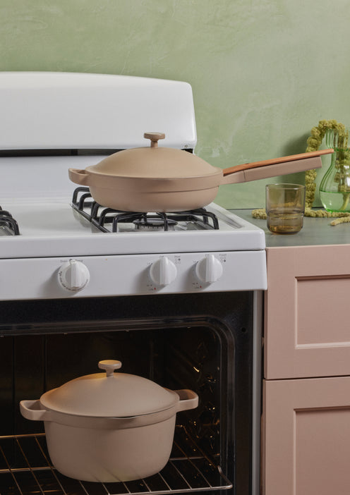 A beige Perfect Pot in the oven and a beige Always Pan on the stove